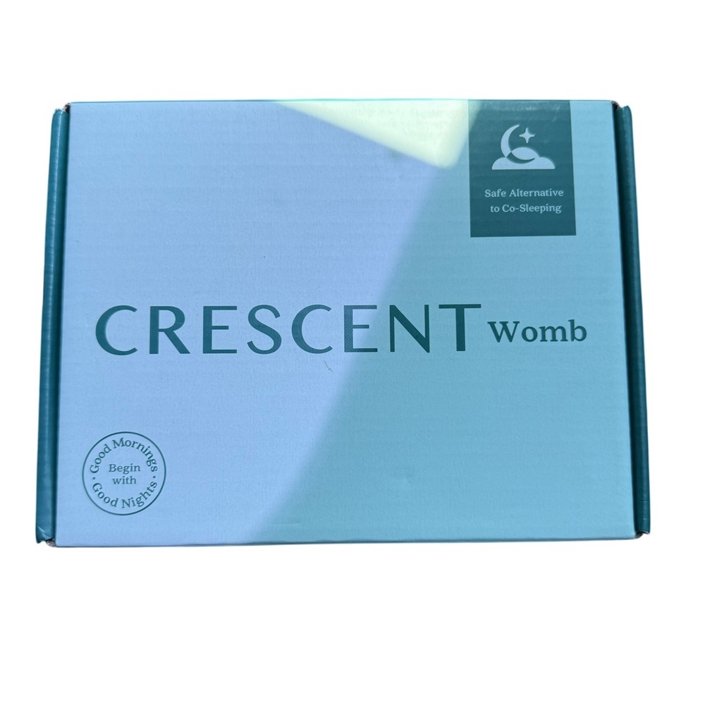 Crescent Womb Infant Support Device